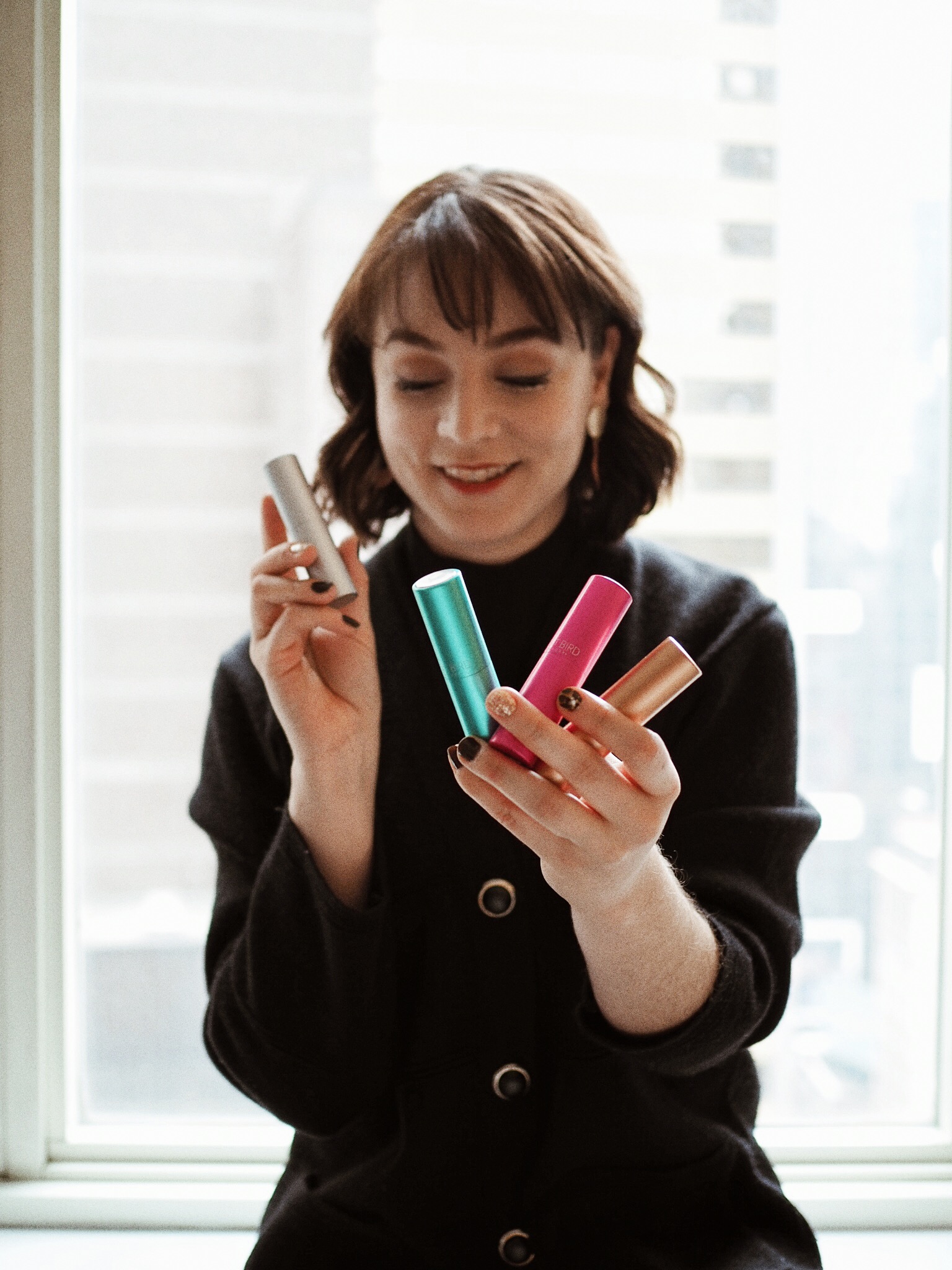Displaying Scentbird's colorful 30-day supply bottles